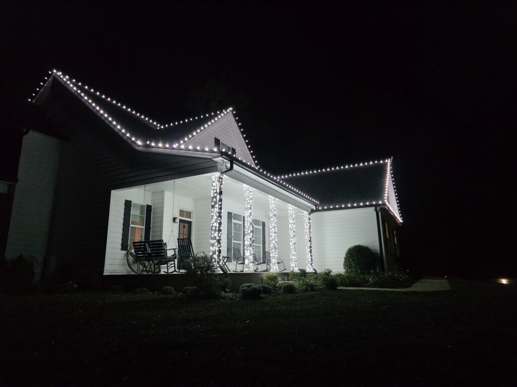 WHite and black house with white cold LED christmas lights WHite and black house with white cold LED christmas lights